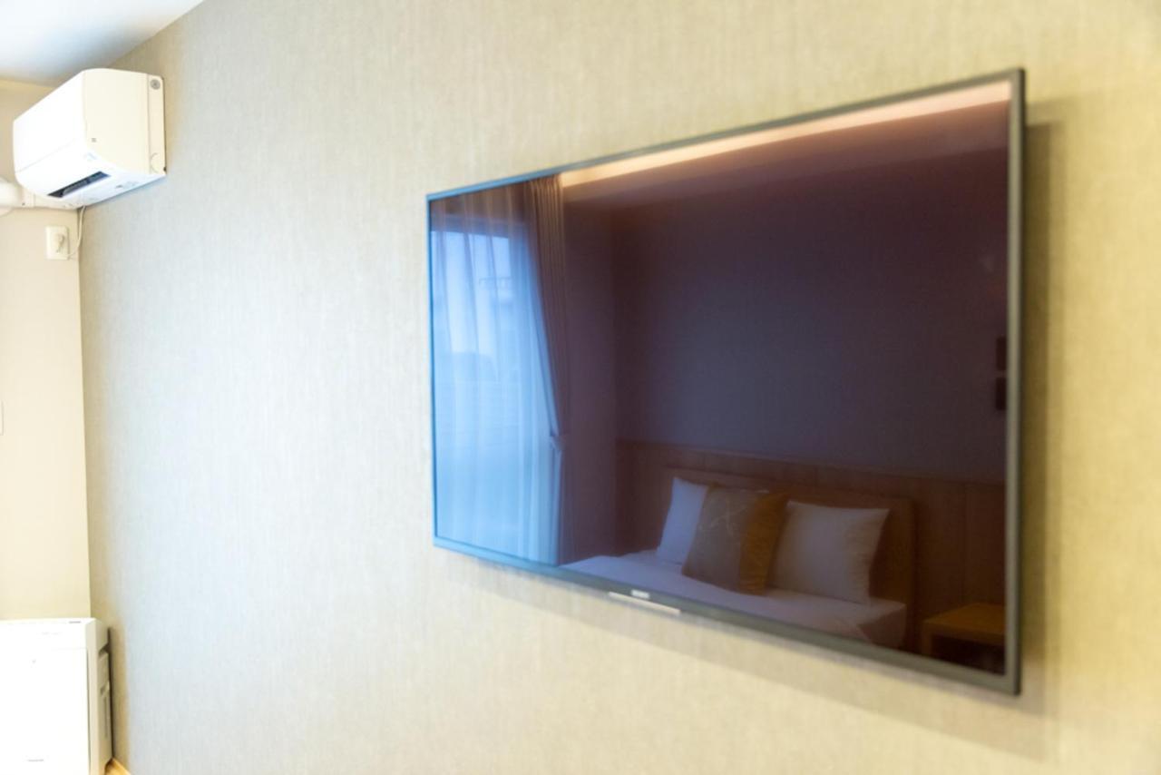 Grand Base Hiroshima Hikarimachi Aparthotel Bagian luar foto