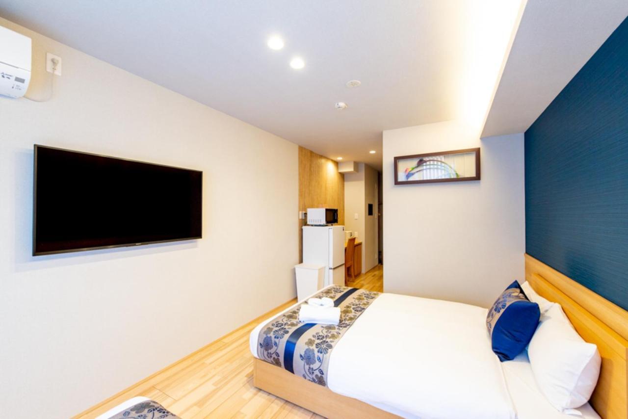 Grand Base Hiroshima Hikarimachi Aparthotel Bagian luar foto