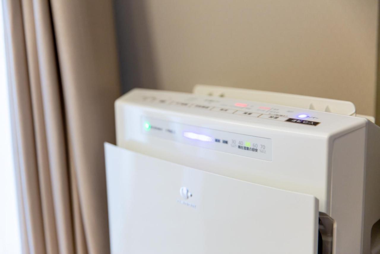 Grand Base Hiroshima Hikarimachi Aparthotel Bagian luar foto