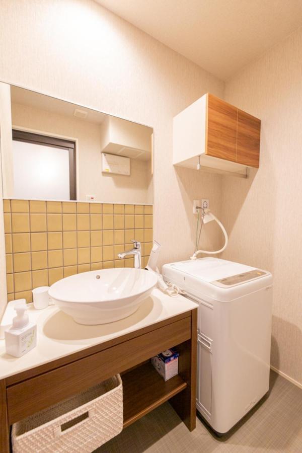 Grand Base Hiroshima Hikarimachi Aparthotel Bagian luar foto