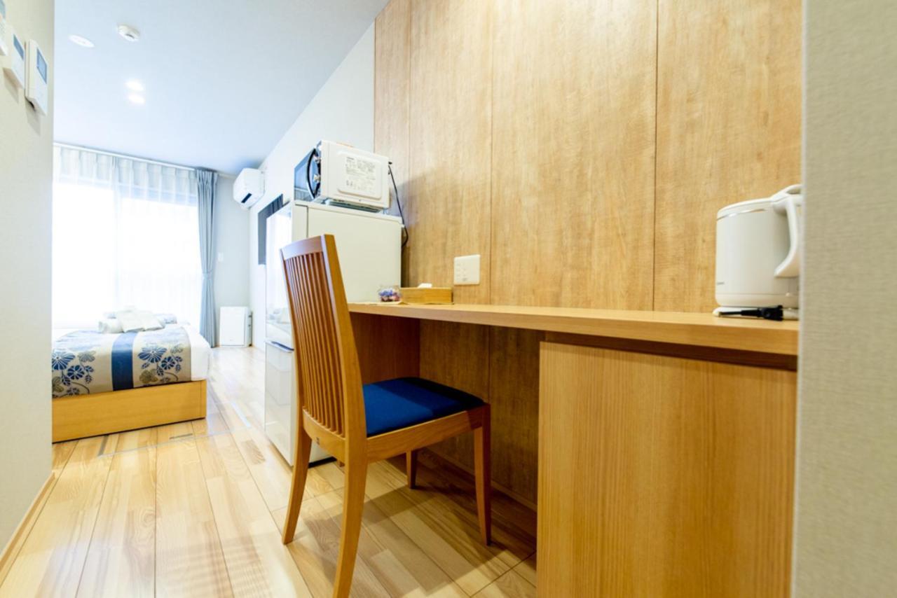 Grand Base Hiroshima Hikarimachi Aparthotel Bagian luar foto