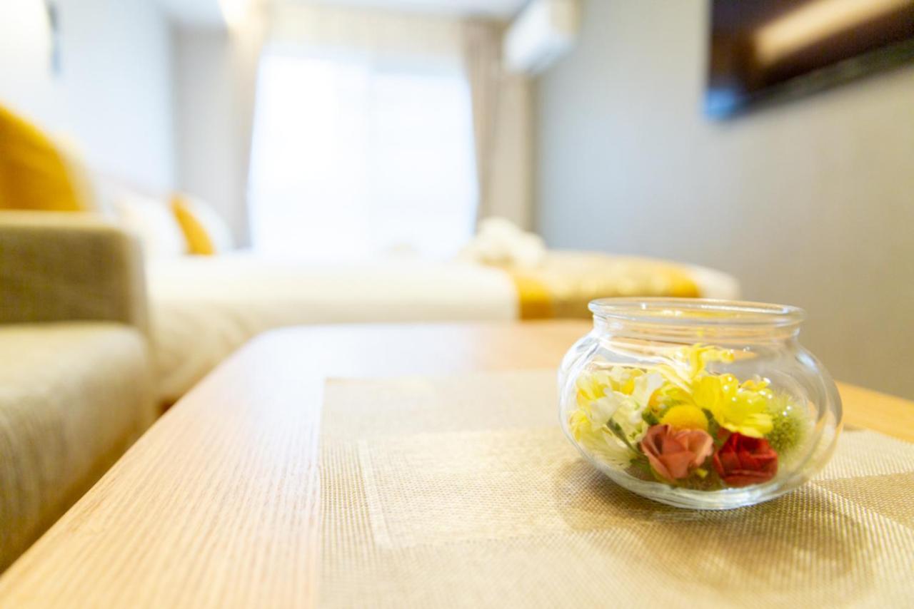 Grand Base Hiroshima Hikarimachi Aparthotel Bagian luar foto