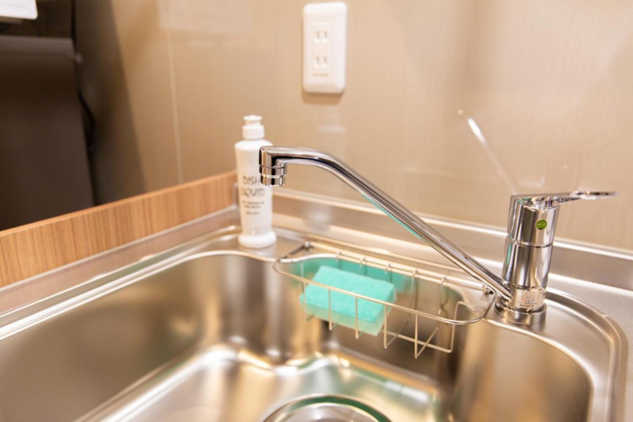 Grand Base Hiroshima Hikarimachi Aparthotel Bagian luar foto