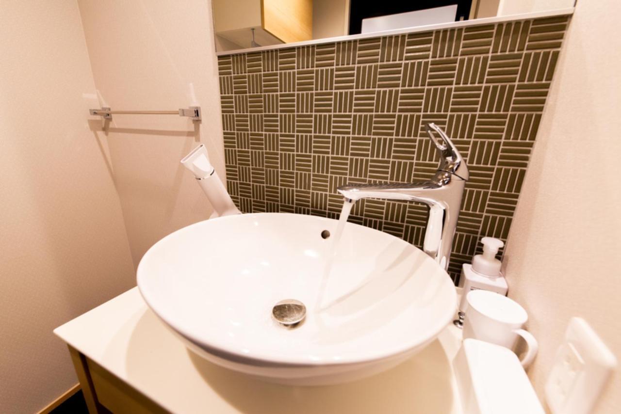 Grand Base Hiroshima Hikarimachi Aparthotel Bagian luar foto