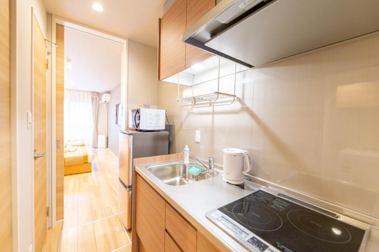 Grand Base Hiroshima Hikarimachi Aparthotel Bagian luar foto