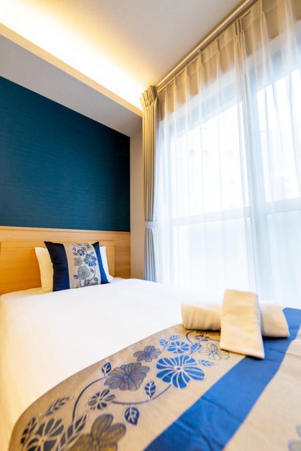 Grand Base Hiroshima Hikarimachi Aparthotel Bagian luar foto